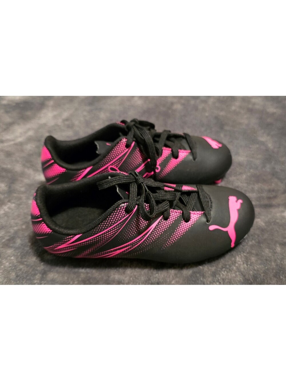 Puma kids black and pink soccer cleats